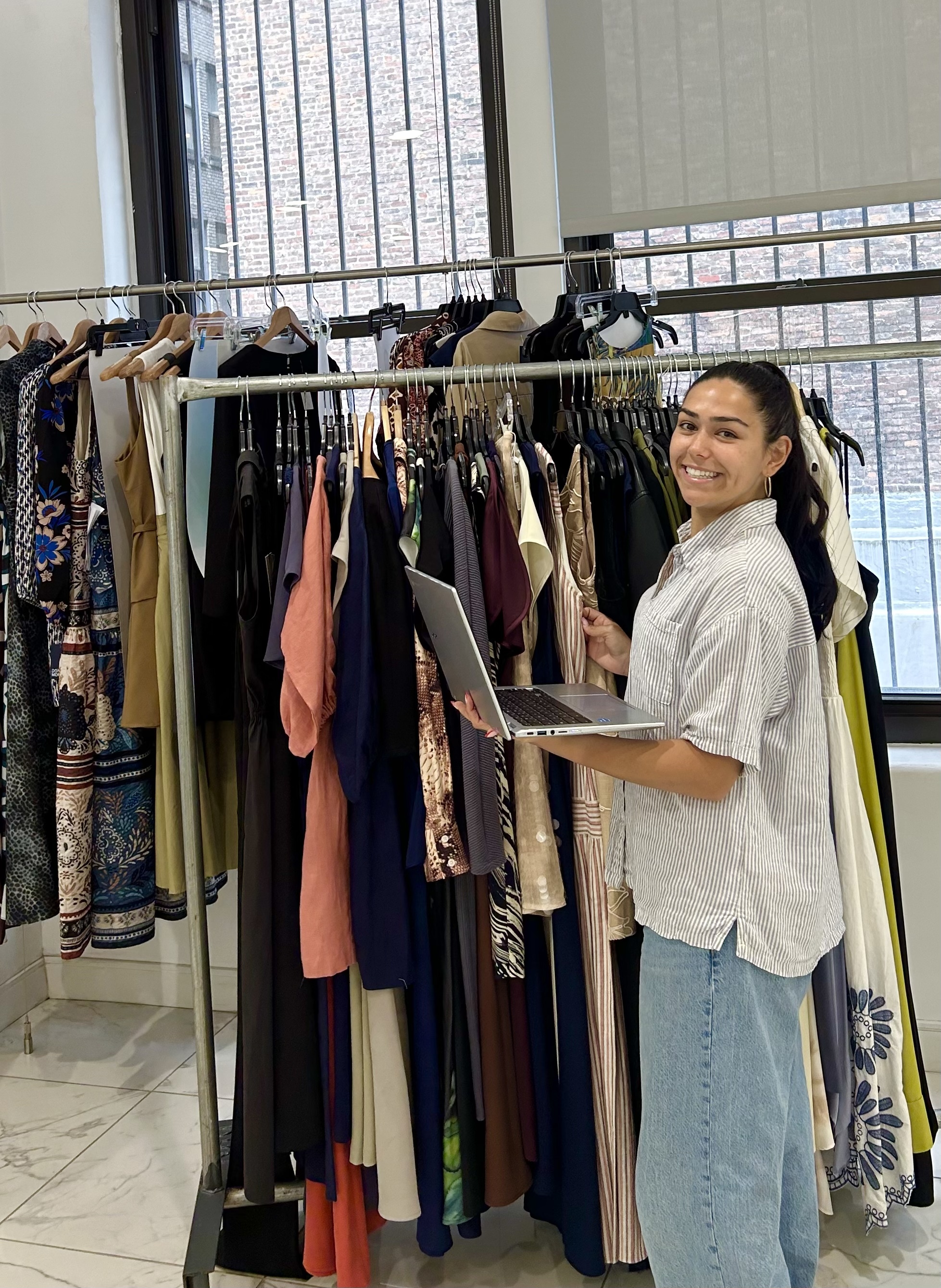 Maggy London intern working with the collection